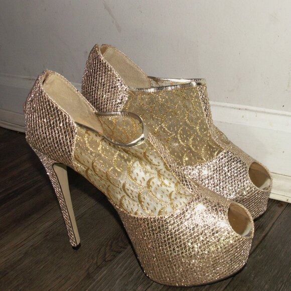 A Women glamorous, gold-toned platform stiletto high heels. - Picture 1 of 6